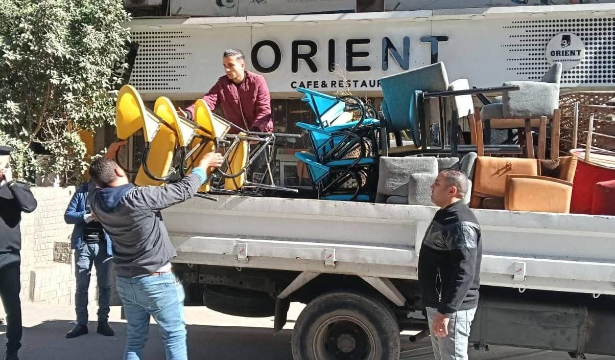 رفع اشغالات الكافيهات والمحال بشارع ناصر الثورة بالعمرانية